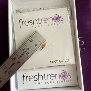 Gold lightening bolt piercing stud